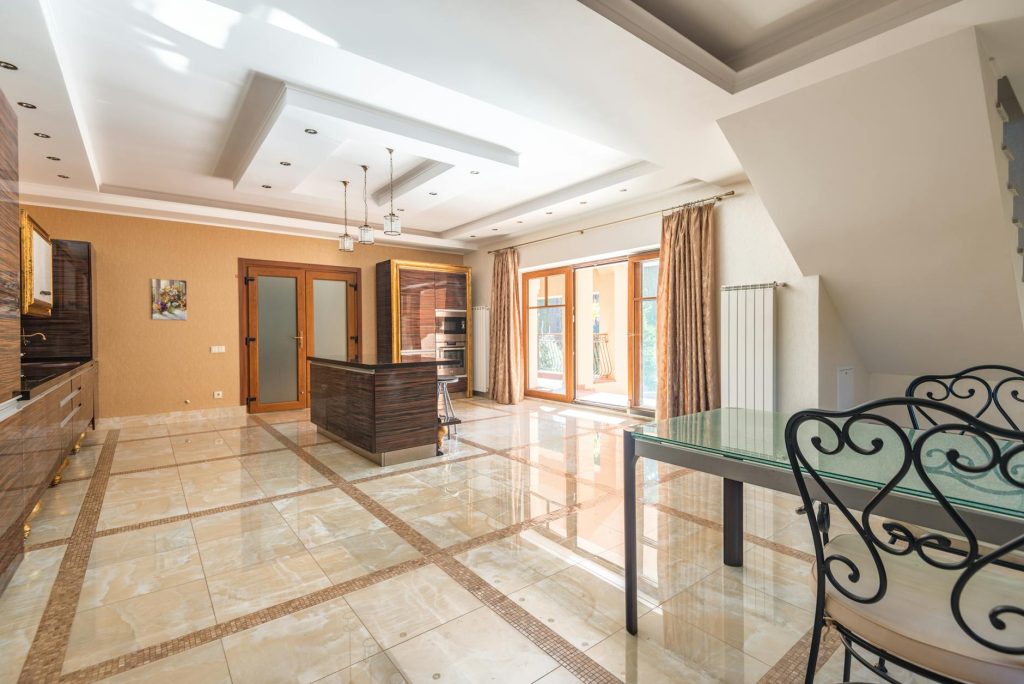 A luxury interior space featuring Egyptian marble flooring and countertops